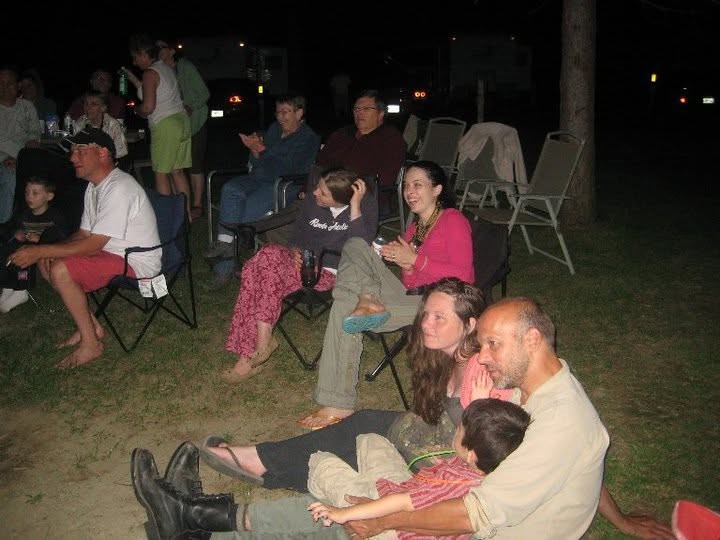 People relaxing together at an outdoor community gathering.